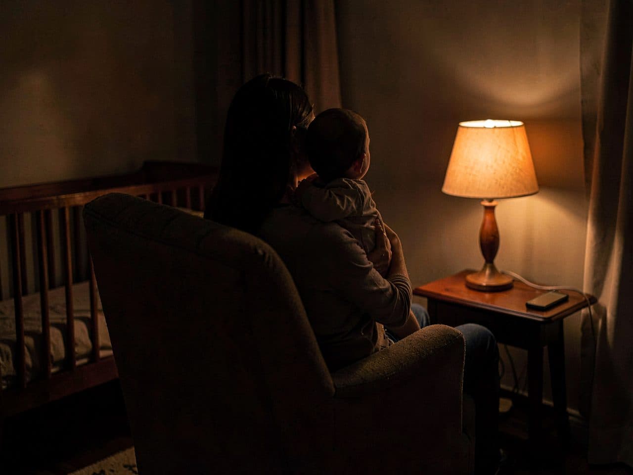 A quiet night feed lit only by a phone screen